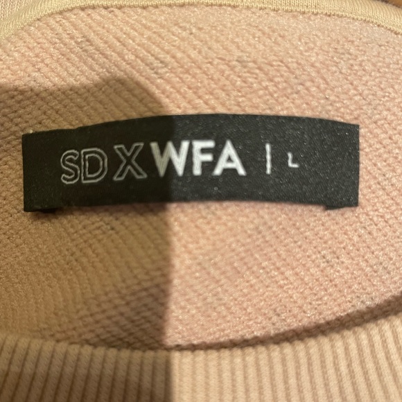 This is a long sleeve top from SDXWFA. It’s a US size large. - Picture 5 of 5